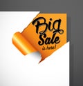 Big Sale is here text uncovered from teared paper corner. Royalty Free Stock Photo