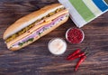 Big sandwich with fresh vegetables on wooden board Royalty Free Stock Photo