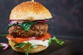 Big sandwich - hamburger burger with beef, tomato, basil cheese