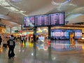 Big screen monitor showing flight schedule and gate at new Istanbul international airport terminal.