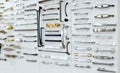 Big selection of handles cabinets parts on a white background shop window. samples of Metal and Stainless Steel handle styles on Royalty Free Stock Photo