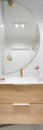 Big semicircle mirror over bathroom washbasin, vertical panorama Royalty Free Stock Photo