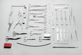 Medical instruments used for surgical operations, laid out on a gray background Royalty Free Stock Photo