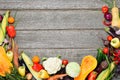 Big set of fresh autumn vegetables on a wood background