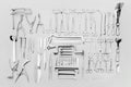 Medical instruments used for surgical operations, laid out on a gray background Royalty Free Stock Photo