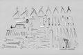 Medical instruments used for surgical operations, laid out on a gray background