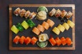 Big set of rolls served on stone plate Royalty Free Stock Photo