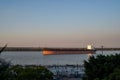 Big ship in Parana River, seen from the promenade in Rosario, Argentina during sunset