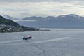 Big ship sailing in norwegian sea near to tromso city with snow mountains Royalty Free Stock Photo