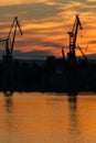 Big shipyard crane at sunset in Gdansk, Poland. Royalty Free Stock Photo