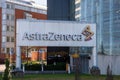 A big sign with AstraZeneca logotype outside the entrance. Royalty Free Stock Photo