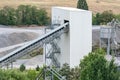 Big silos, belt conveyors and mining equipment in a quarry. Royalty Free Stock Photo