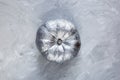 Big silver Pumpkin on table, top view. Thanksgiving day composition on gray background. Autumn harvest concept. Halloween