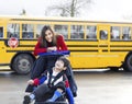 Big sister with disabled brother at school