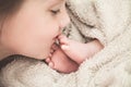 Big sister kissing feet of her newborn brother Royalty Free Stock Photo