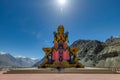 Big Sitting Buddha Statue at Diskit Monastery with Himalaya Range in the back - Nubra Valley, India. Royalty Free Stock Photo