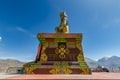 Big Sitting Buddha Statue at Diskit Monastery with Himalaya Range in the back - Nubra Valley, India. Royalty Free Stock Photo