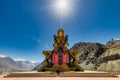 Big Sitting Buddha Statue at Diskit Monastery with Himalaya Range in the back - Nubra Valley, India. Royalty Free Stock Photo