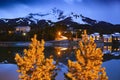 Big Sky Mountain Village on dusk, snowy Lone Mountain, Montana USA