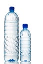Big and small mineral water in plastic bottle white background Royalty Free Stock Photo