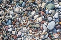 Pebbles at the beach. Stone background image. Rounded different size pebbles at the beach.