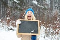 Big smile and big discounts. Happy young woman advertises ads.