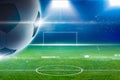 Big soccer ball above green stadium with bright spotlights Royalty Free Stock Photo