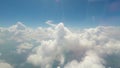 Big soft clouds floating in sky, interminable vast space, view from flying plane