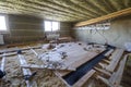 Big spacious light empty attic room under construction and renovation. Mansard floor and ceiling insulation with rock wool. Fiber