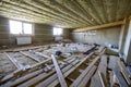 Big spacious light empty attic room under construction and renovation. Mansard floor and ceiling insulation with rock wool. Fiberg
