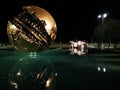 Big Sphere A. Pomodoro in Pesaro, Italy at night