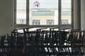 Big stack of black chairs arranged in the room Royalty Free Stock Photo