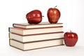Big Stack Of Books And Red Apples On White Background Royalty Free Stock Photo