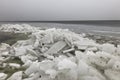Big stack of broken ice on sea or lake shore, change of climate, Royalty Free Stock Photo