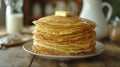 Big stack of homemade crepes or thin crepes with butter in rustic style Royalty Free Stock Photo