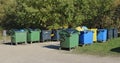 Big standard  isolated plastic trash bins are located near forest Royalty Free Stock Photo