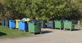 Big standard  isolated plastic trash bins are located near forest Royalty Free Stock Photo