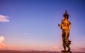 Big standing Buddha statue and the sky at sunset Royalty Free Stock Photo