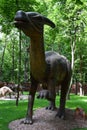 Big statue of Parasaurolophus dinosaur in a forest Royalty Free Stock Photo