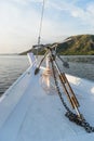 Big steel anchor on the front white deck of the boat Royalty Free Stock Photo