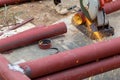 Big steel pipe pipes are being cut from steel cutters by construction workers. Large iron hollow Use it as a roof pole. Sparking