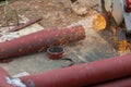 Big steel pipe pipes are being cut from steel cutters by construction workers. Large iron hollow Use it as a roof pole. Sparking