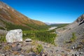 Big stone, mountains and sky.