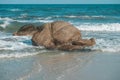 Big stone with Sea wave on the Hua Hin beach, Prachuap Khiri Khan, Thailand. Pastel tone Royalty Free Stock Photo