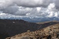 Big stones on the background of high mountain snow peaks ranges Royalty Free Stock Photo