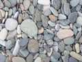 Big stones on the beach. Background from stones. Boulders on the seashore. Smooth cobblestones