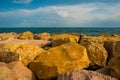 Big stones of groyne by the sea