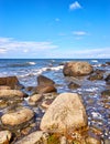 Big stones under blue sky with clouds. Baltic Sea in Mecklenburg-Vorpommern Royalty Free Stock Photo