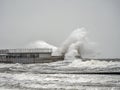 Big stormy waves hitting the pier