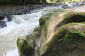 water flow over mossy rock Royalty Free Stock Photo